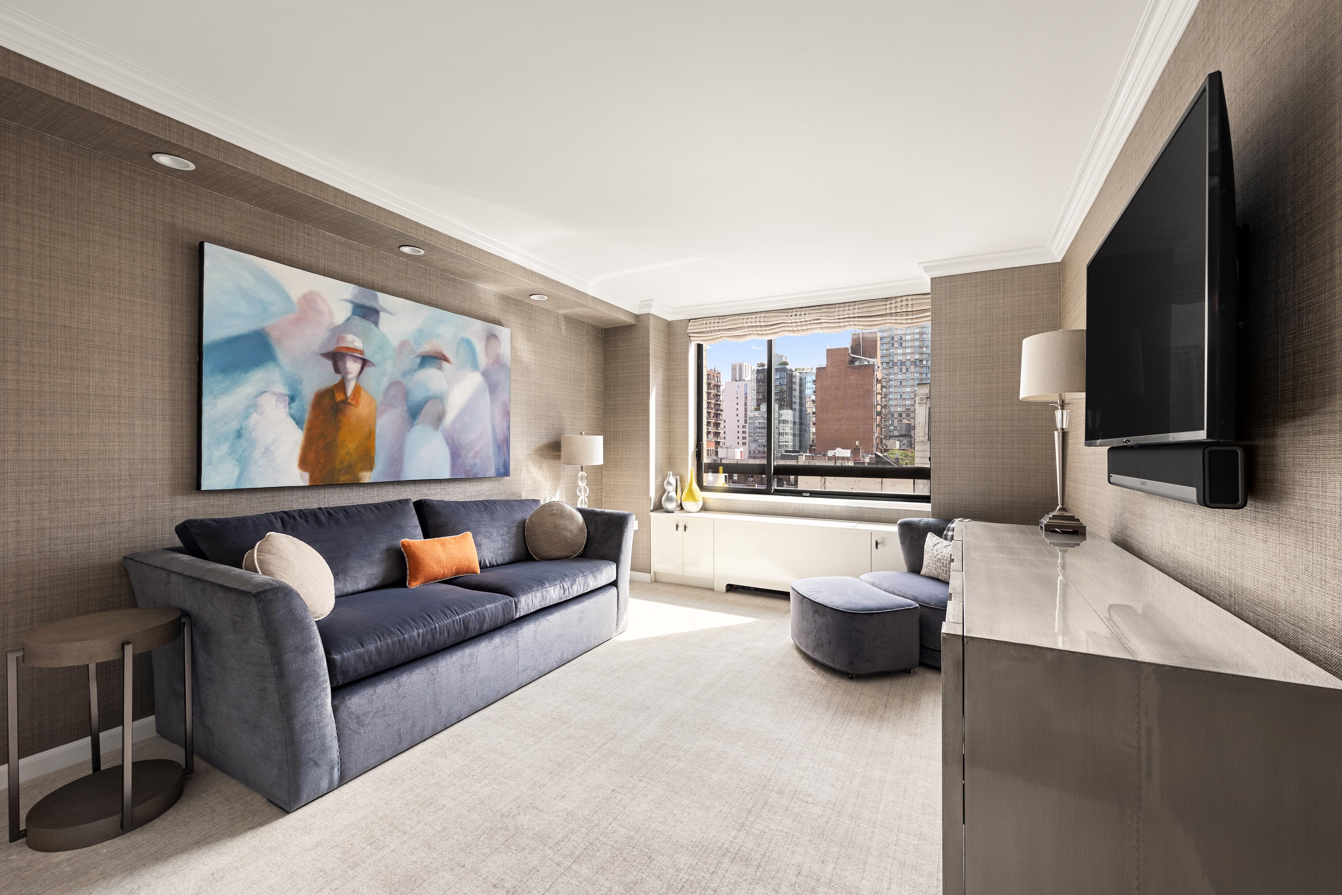 171 East 84th Street, Unit 7B Manhattan, NY 10028 - Photo 10 of 19 a living room with furniture and a flat screen tv