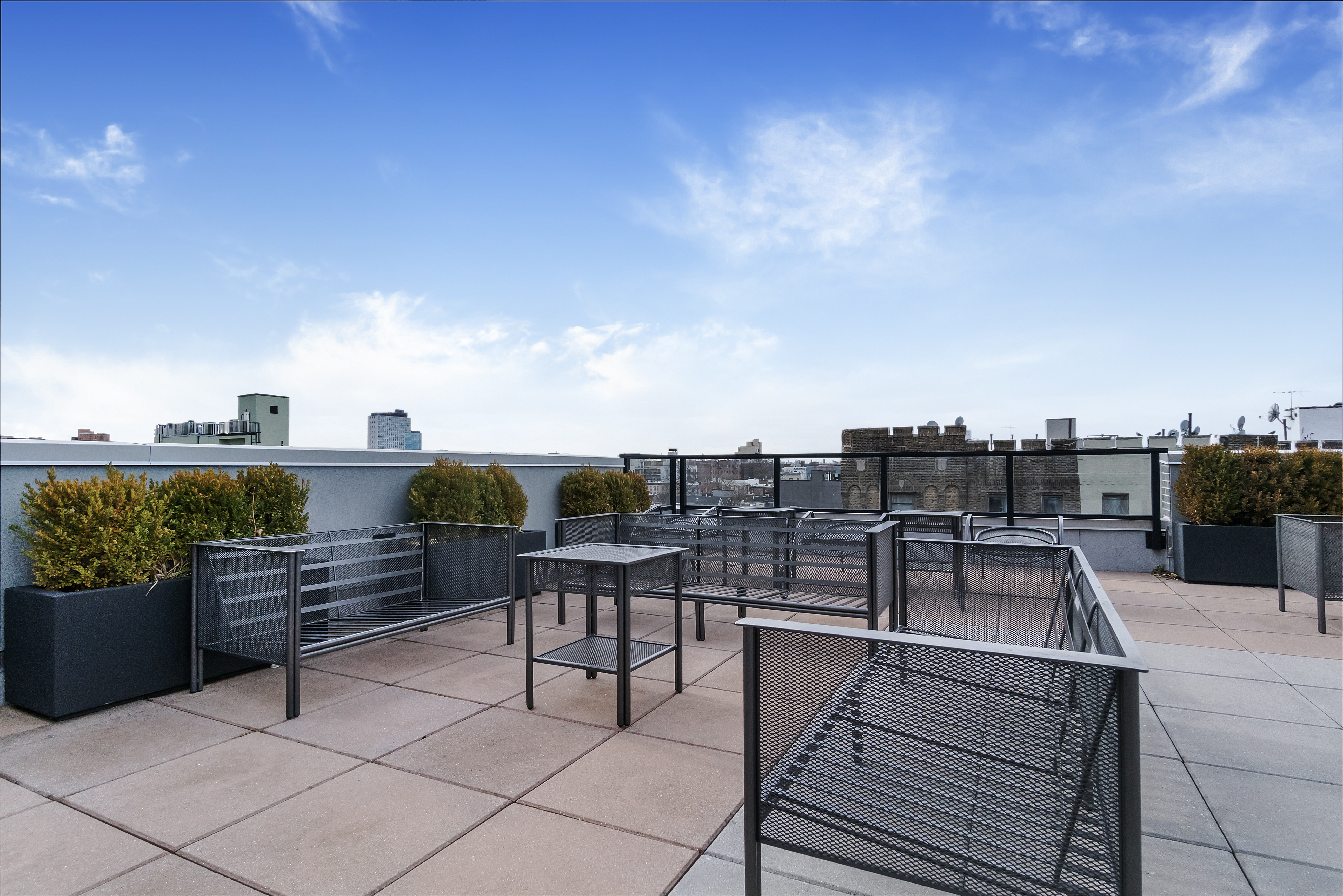 401 Rutland Road, Unit 2C Brooklyn, NY 11203 - Photo 10 of 13 a roof deck with table and chairs and a potted plant