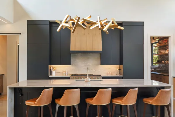 a kitchen with stainless steel appliances a sink and a refrigerator