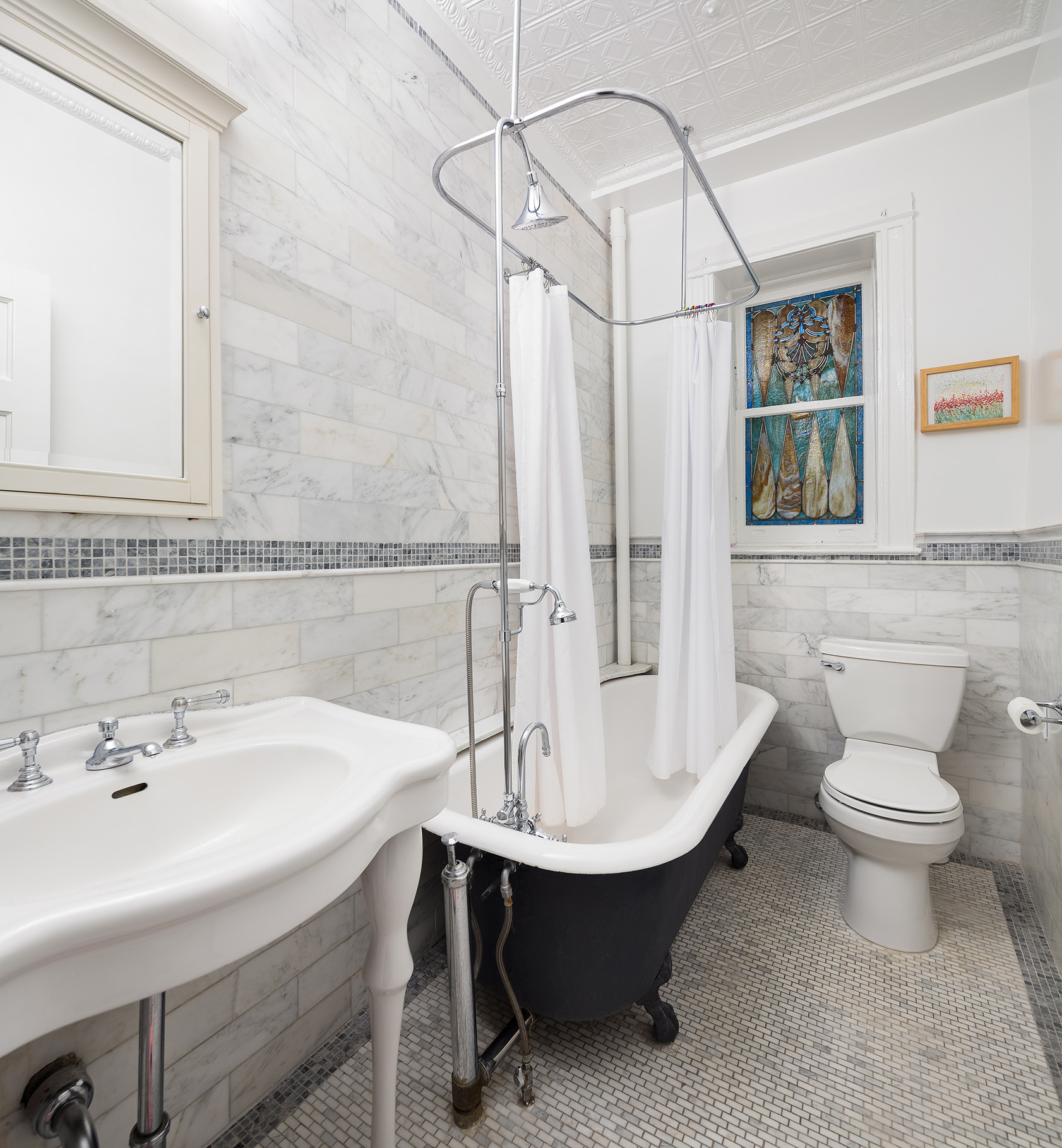 567 8th Street, Unit 2 Brooklyn, NY 11215 - Photo 7 of 9 a bathroom with a sink a toilet and shower