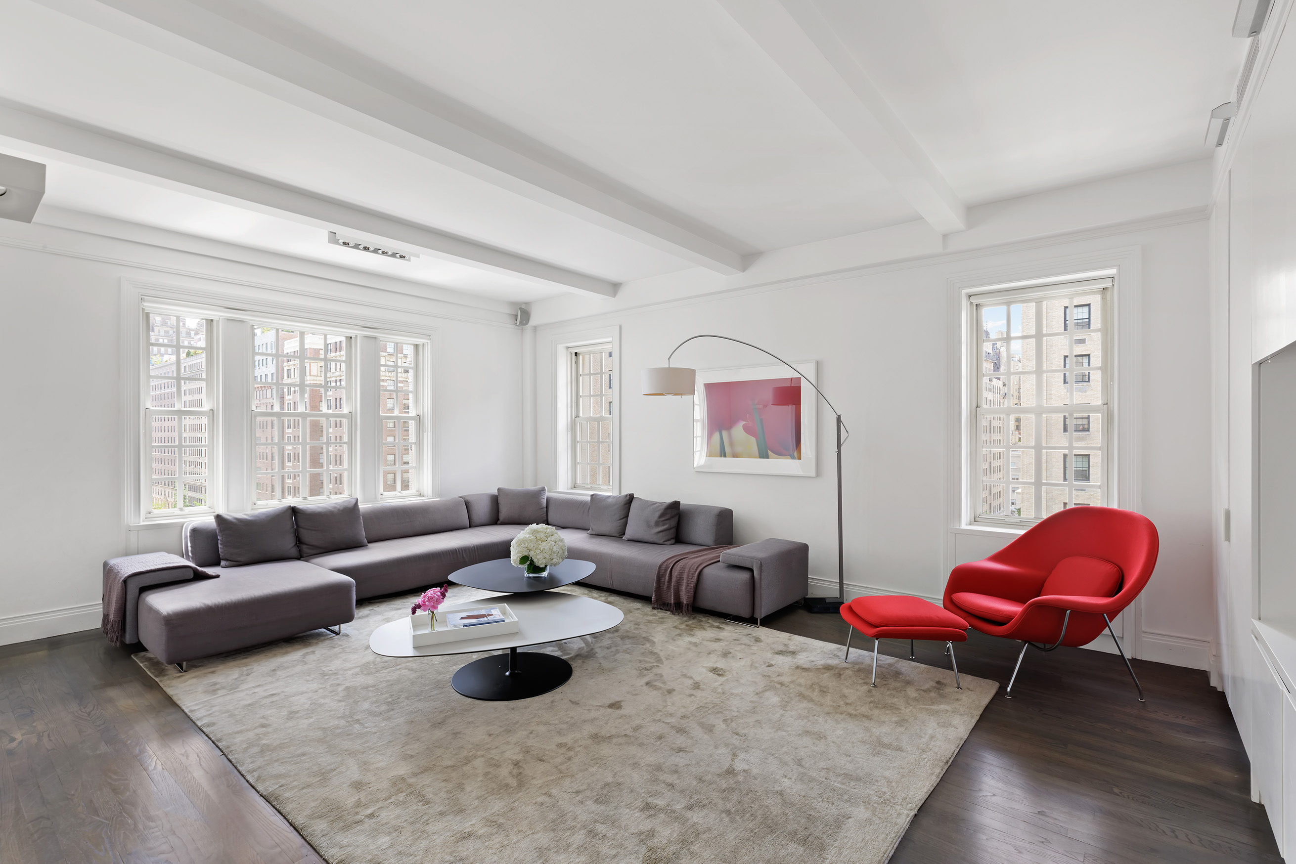 863 Park Avenue, Unit 8W Manhattan, NY 10075 - Photo 1 of 15 a living room with furniture and a large window
