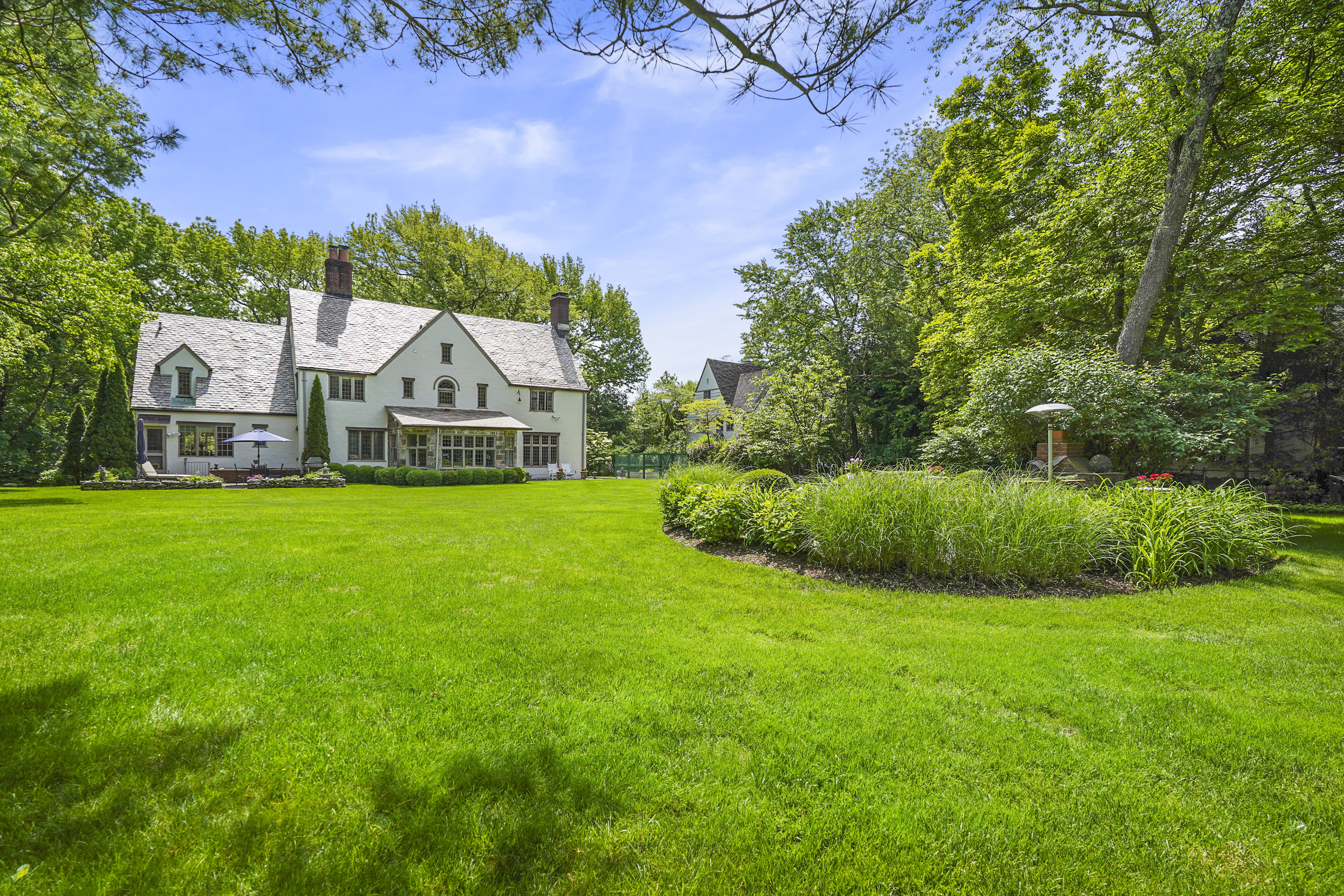 19 Avon Road Larchmont, NY 10538 - Photo 20 of 35 a view of a house with a big yard