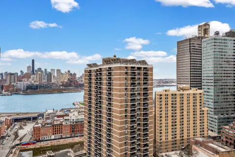a view of a city with tall buildings