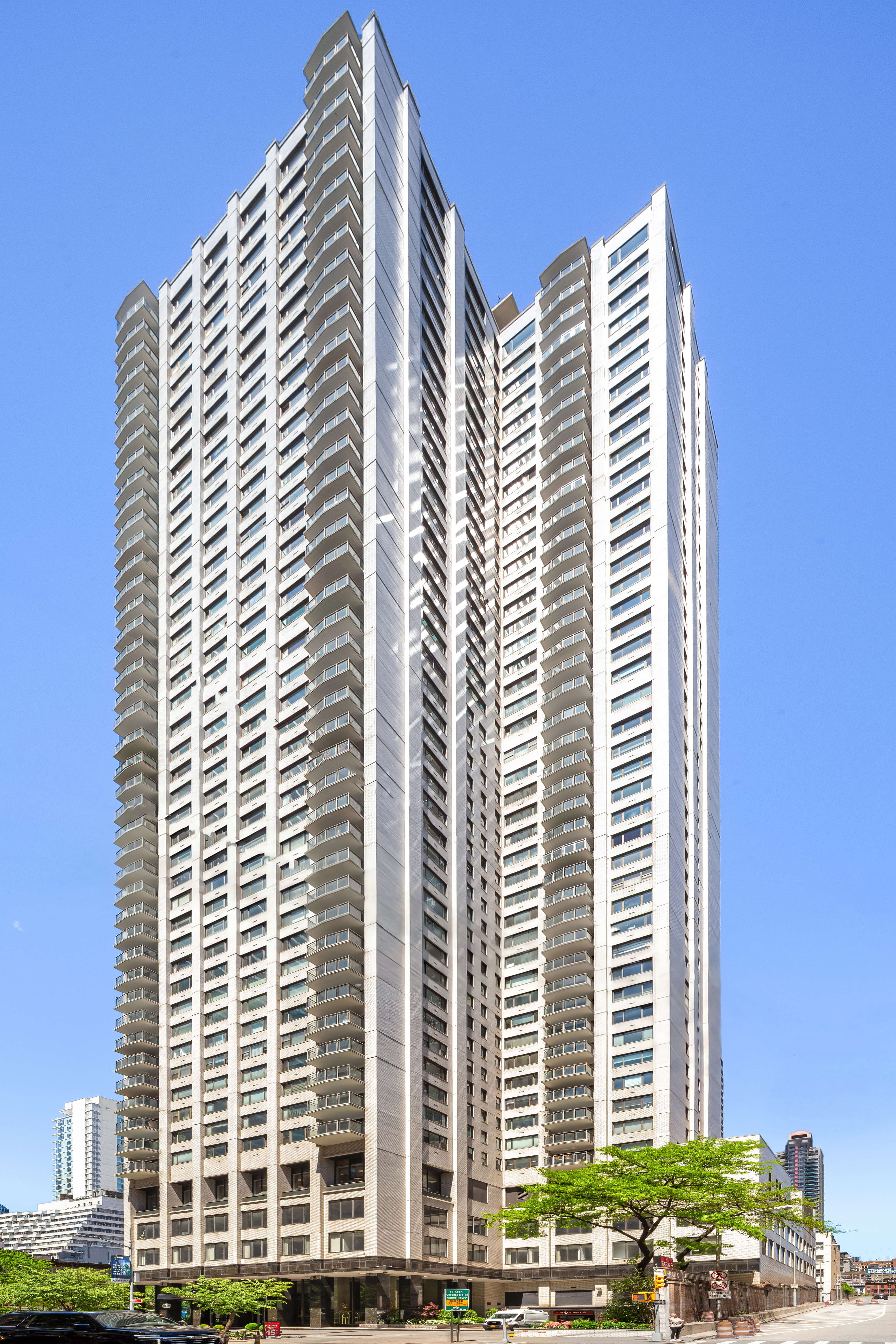 303 East 57th Street, Unit 20LA Manhattan, NY 10022 - Photo 16 of 18 a front view of a building with glass windows