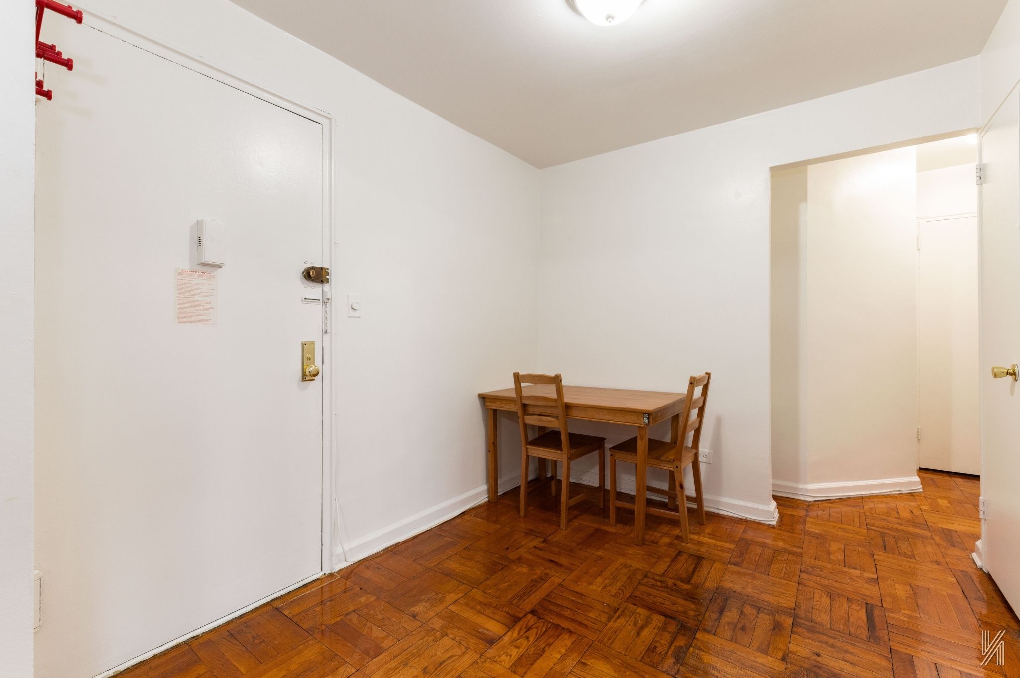33-24 Junction Boulevard, Unit 1R Queens, NY 11372 - Photo 9 of 17 a workspace room with a table and chairs
