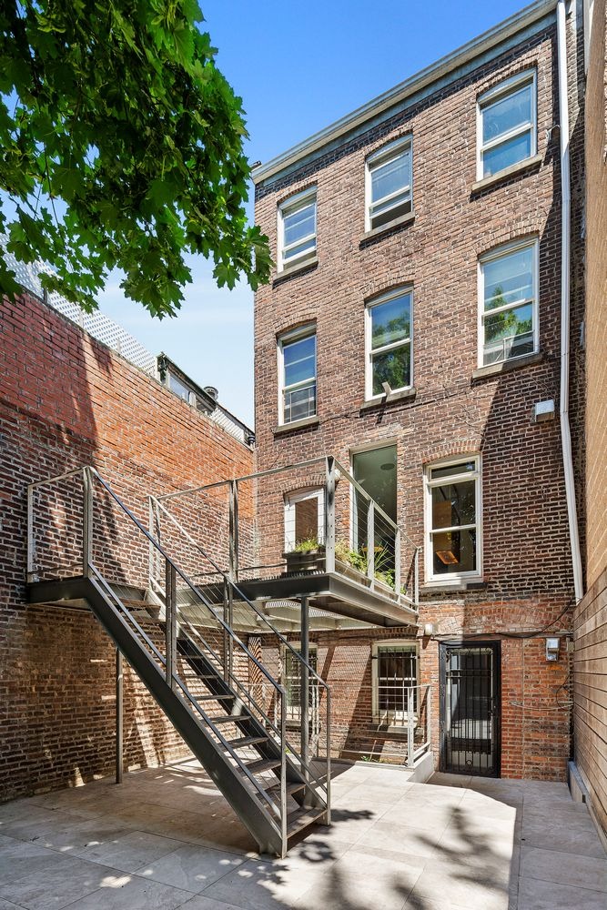 64 Clifton Place, Unit PARLOR Brooklyn, NY 11238 - Photo 14 of 17 a front view of a building