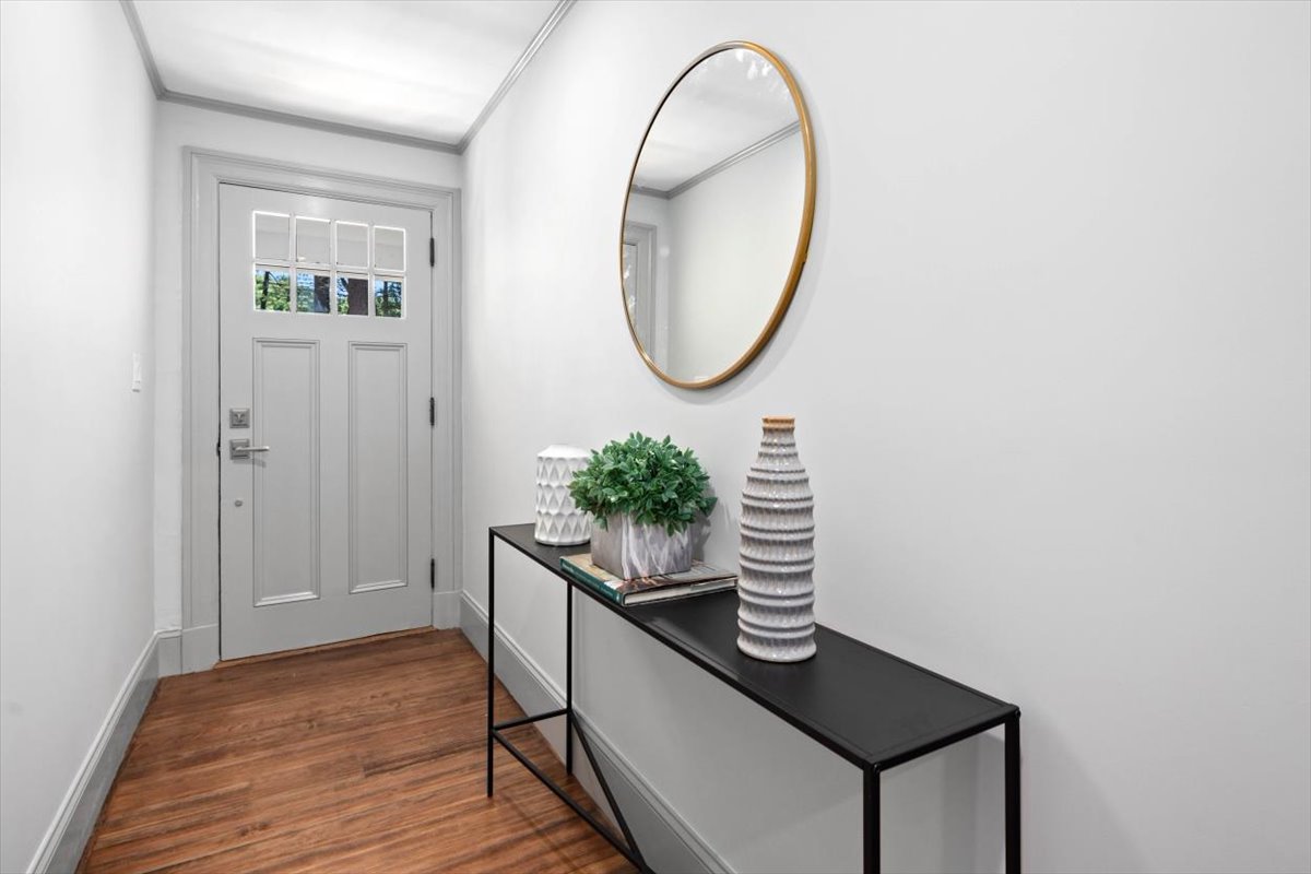 49 Garrison Road Hingham, MA 02043 - Photo 9 of 30 a room with painting on the wall and a potted plant