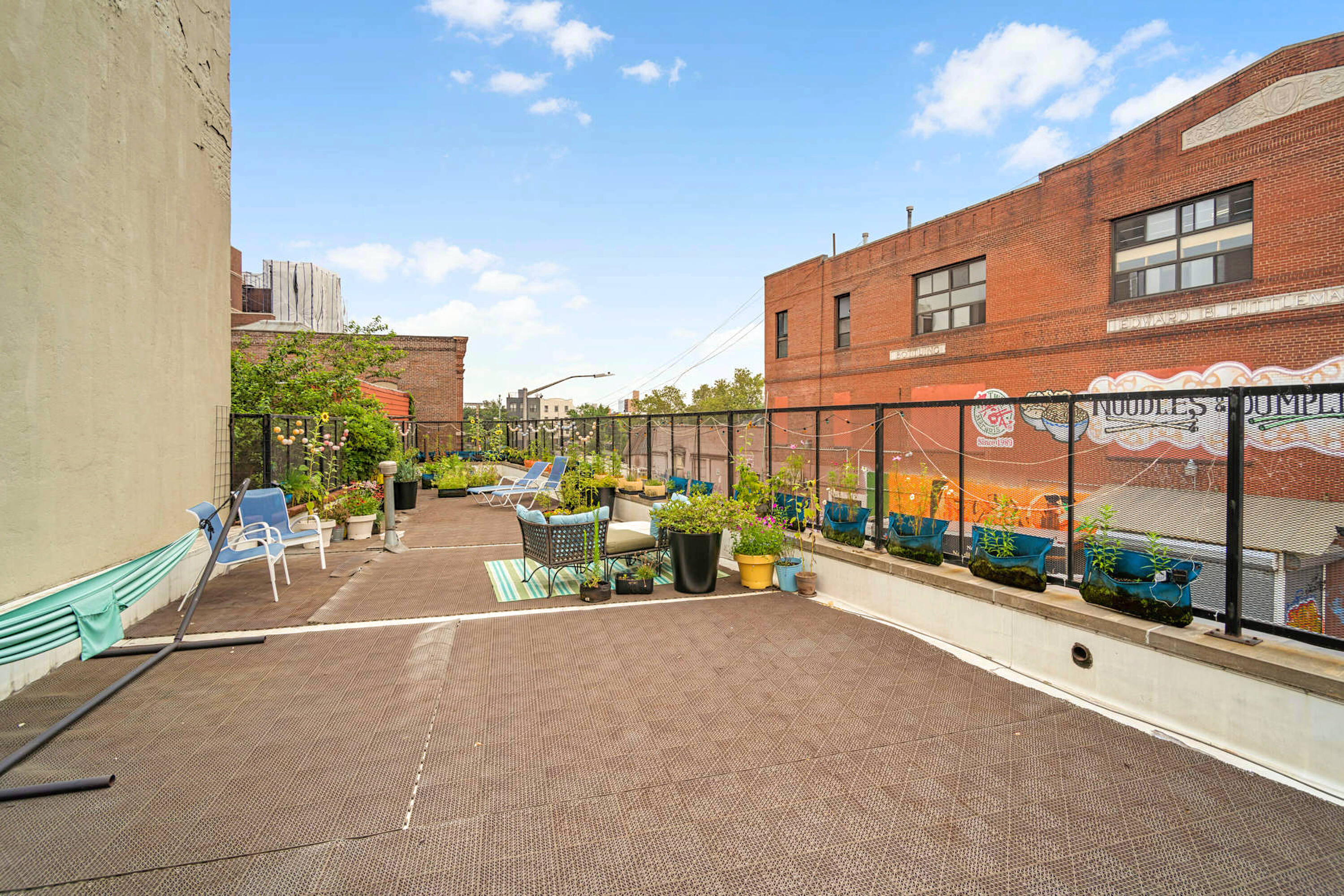 251 Montrose Avenue Brooklyn, NY 11206 - Photo 10 of 15 a view of a terrace with chairs