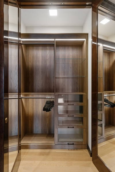 53 West 53rd Street, Unit 52B Manhattan, NY 10019 - Photo 8 of 15 a view of walk in closet with empty racks