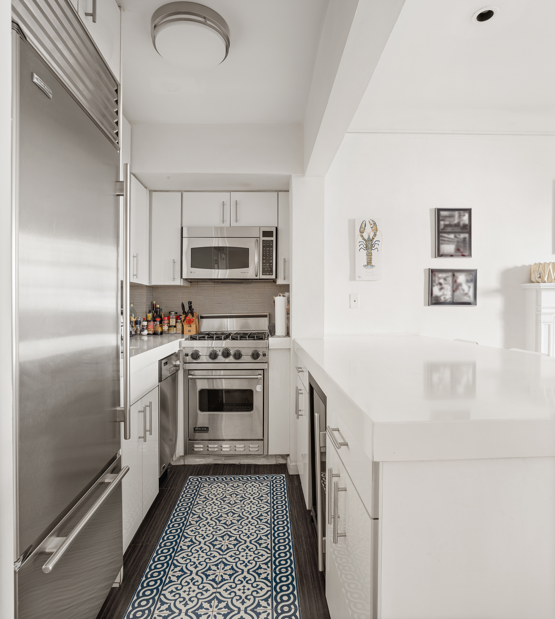 159 East 63rd Street, Unit 2/3 Manhattan, NY 10065 - Photo 6 of 13 a kitchen with a refrigerator stove and a sink