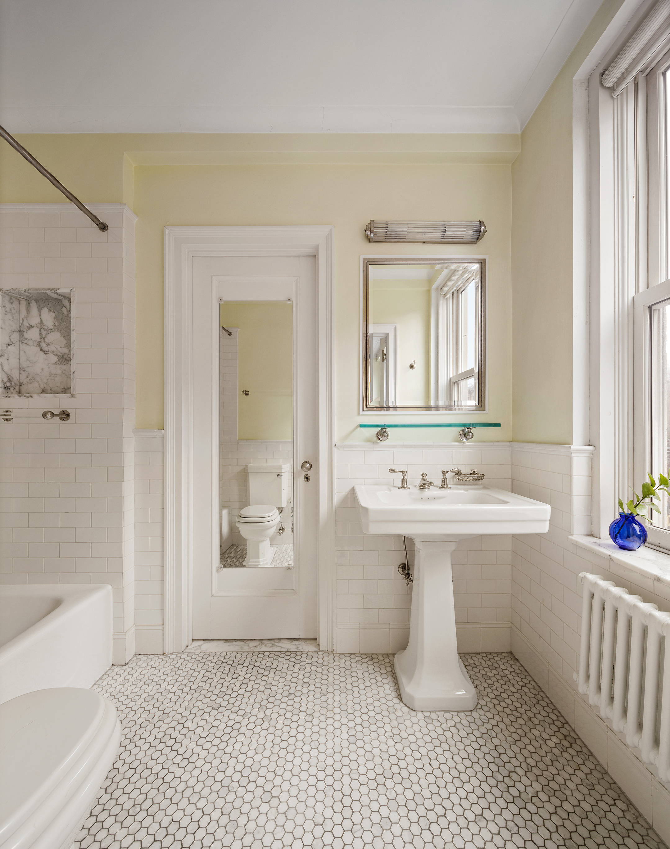35 Prospect Park West, Unit 3B Brooklyn, NY 11215 - Photo 12 of 16 a view of a bathroom with a sink and mirror