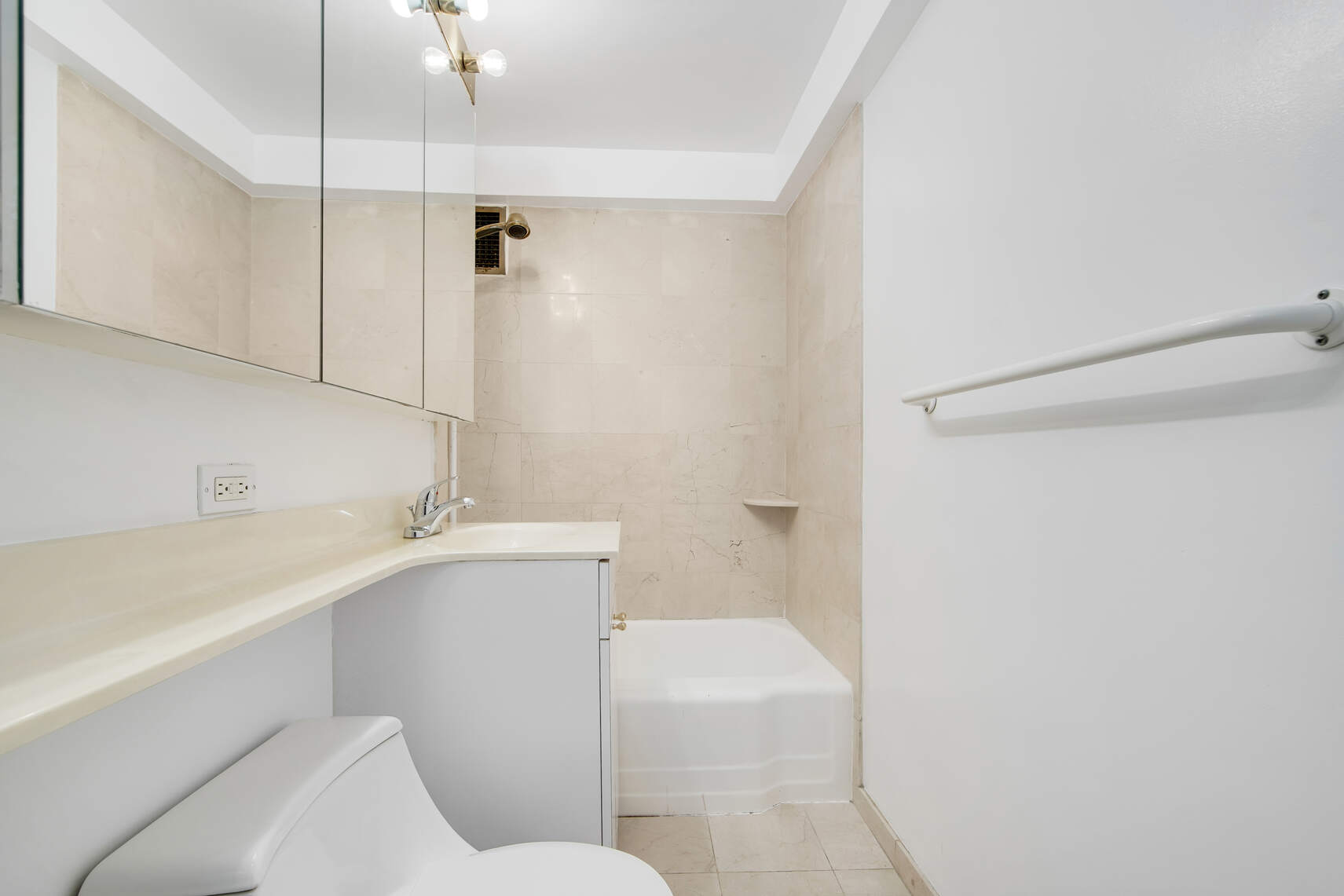 420 East 64th Street, Unit W4A Manhattan, NY 10065 - Photo 4 of 5 a bathroom with a sink a toilet and shower