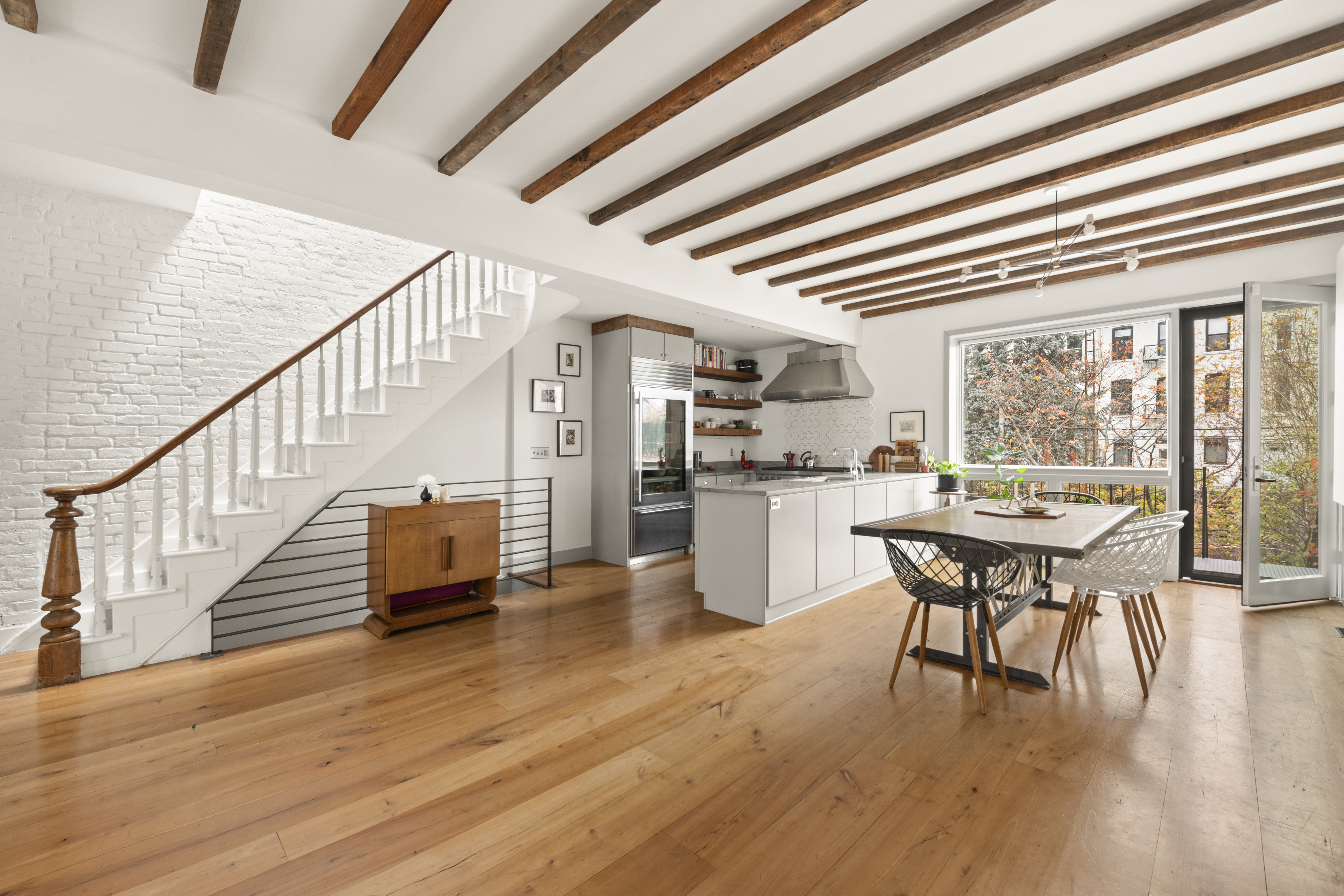 203 Huntington Street Brooklyn, NY 11231 - Photo 3 of 16 a dining room with furniture wooden floor and a chandelier