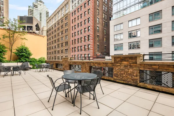 a view of a dinning table and chairs in the patio