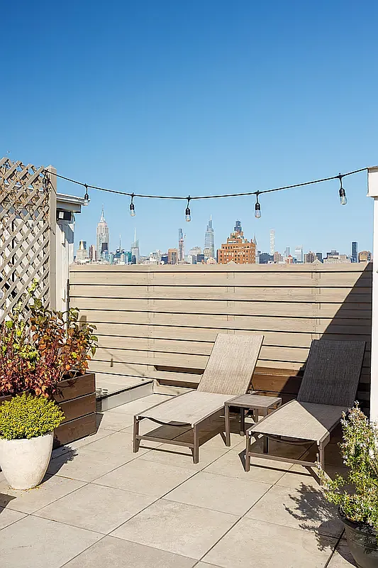 300 East 4th Street, Unit 1A Manhattan, NY 10009 - Photo 9 of 10 a view of a terrace with chairs and potted plants