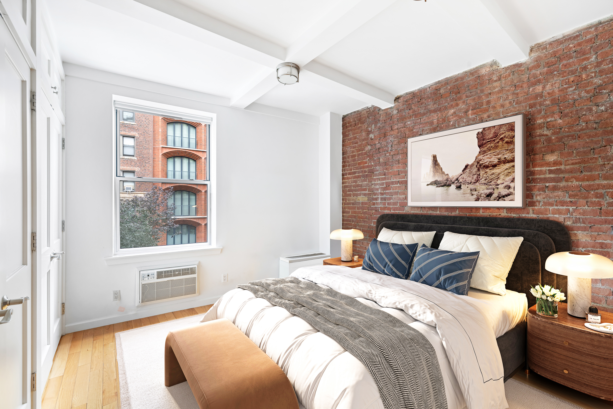 23 East 10th Street, Unit 231 Manhattan, NY 10003 - Photo 4 of 9 a bedroom with bed and a window