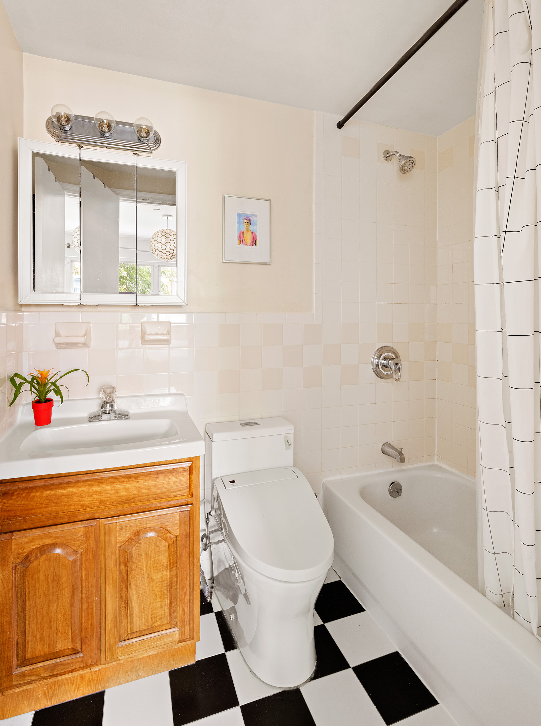 1427 Greene Avenue, Unit 2 Brooklyn, NY 11237 - Photo 8 of 9 a bathroom with a sink a toilet and shower