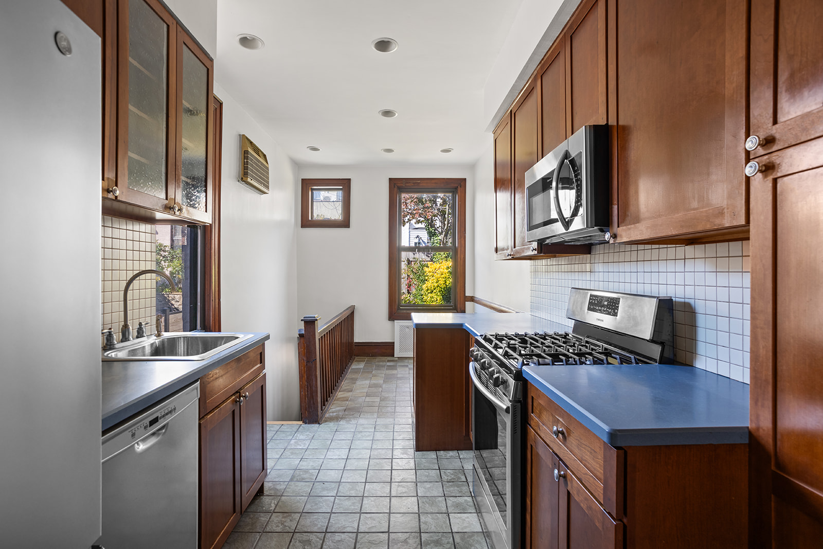 26 Fuller Place Brooklyn, NY 11215 - Photo 6 of 14 a kitchen with stainless steel appliances granite countertop a sink a stove and a refrigerator