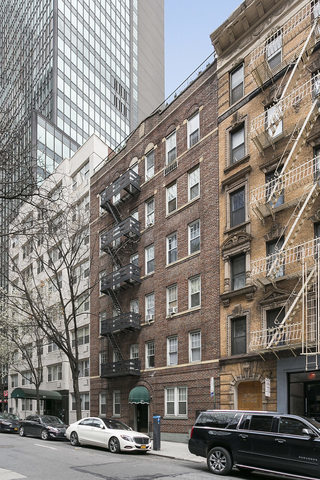 223 East 50th Street, Unit 6B Manhattan, NY 10022 - Photo 6 of 7 a car parked in front of a building