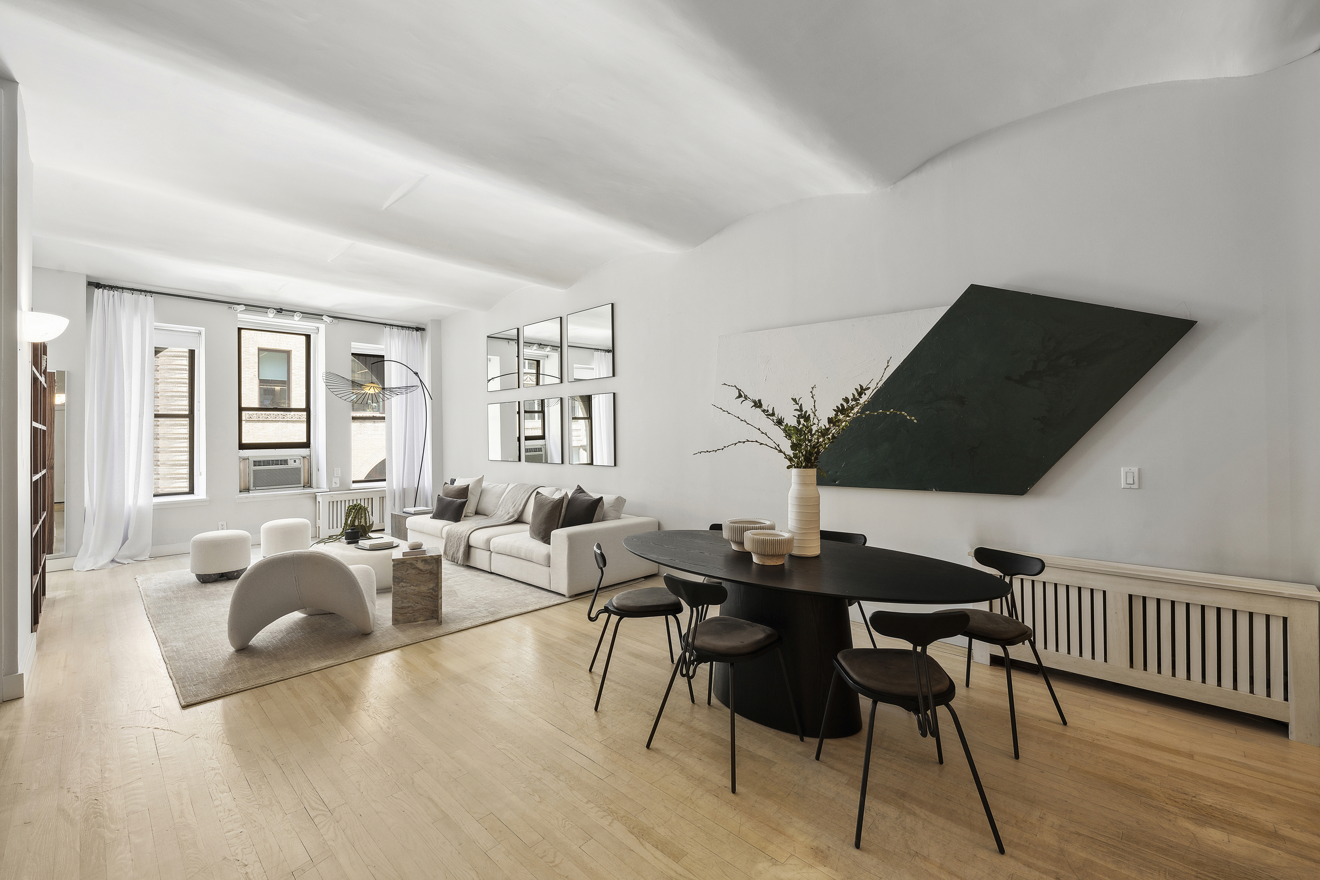 4 West 16th Street, Unit 4A Manhattan, NY 10011 - Photo 3 of 11 a living room with furniture and wooden floor