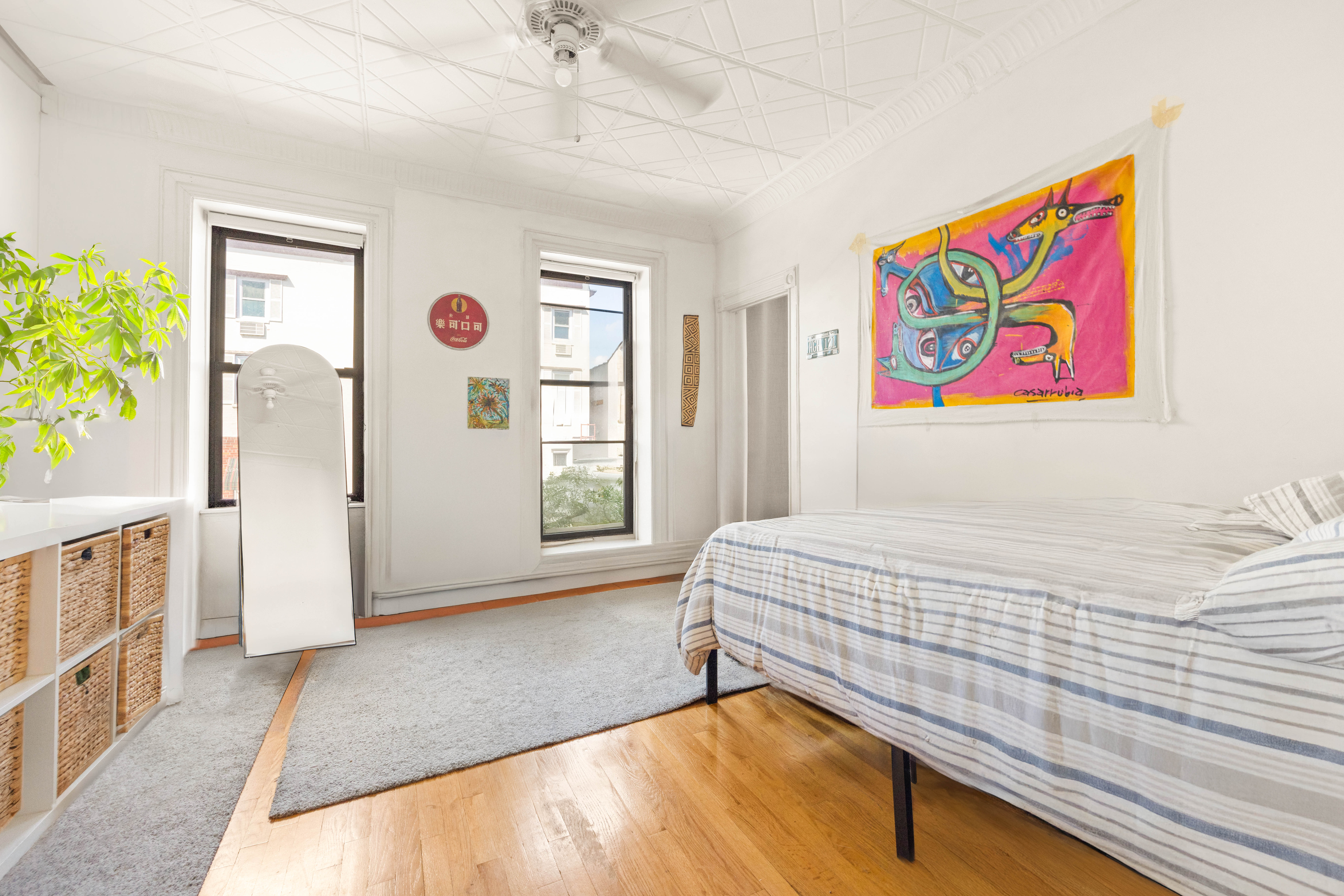 192-194 Union Street Brooklyn, NY 11231 - Photo 30 of 37 a bedroom with a bed and a painting on the wall