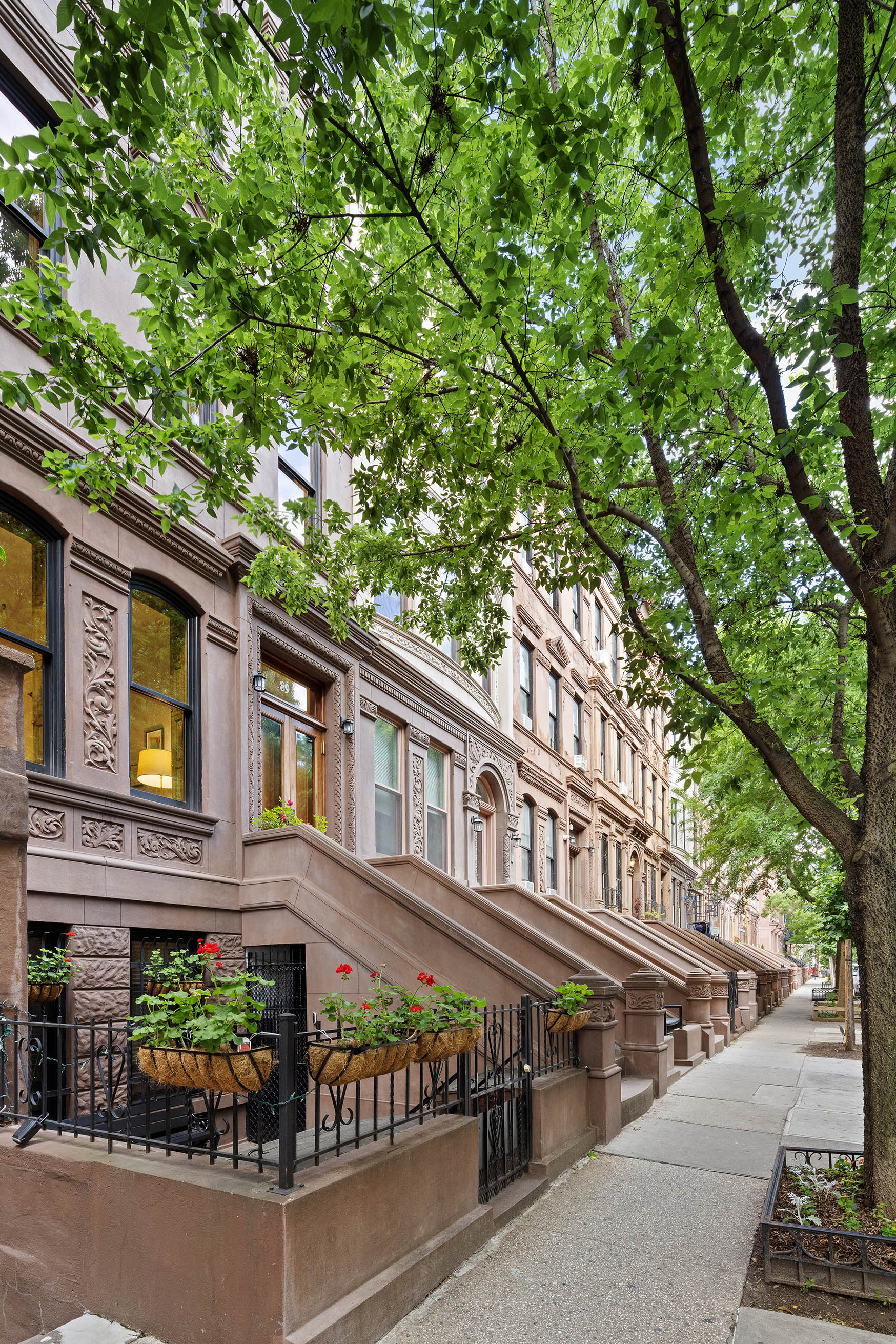 89 West 119th Street Manhattan, NY 10026 - Photo 2 of 22 front view of a building with a street