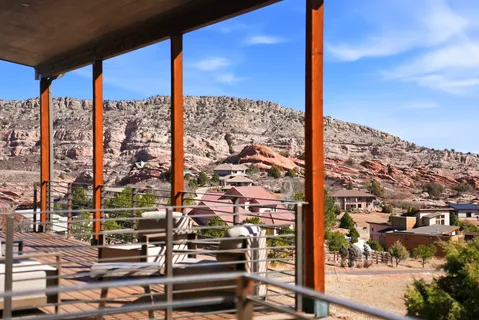a living room with furniture large window and a fireplace