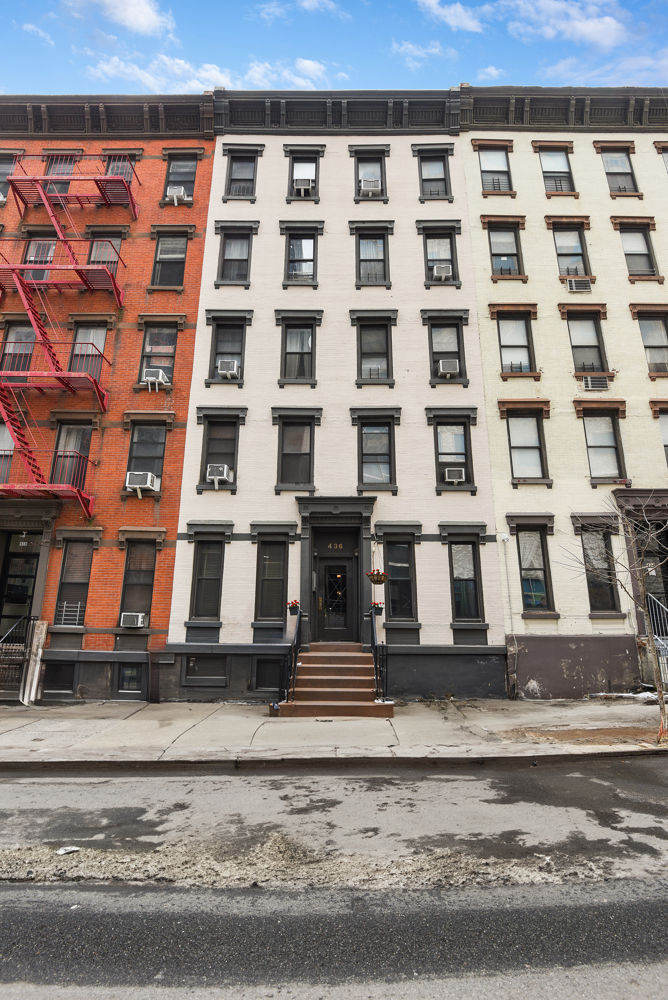 436 East 66th Street, Unit 1W Manhattan, NY 10065 - Photo 18 of 19 a front view of a building with a street