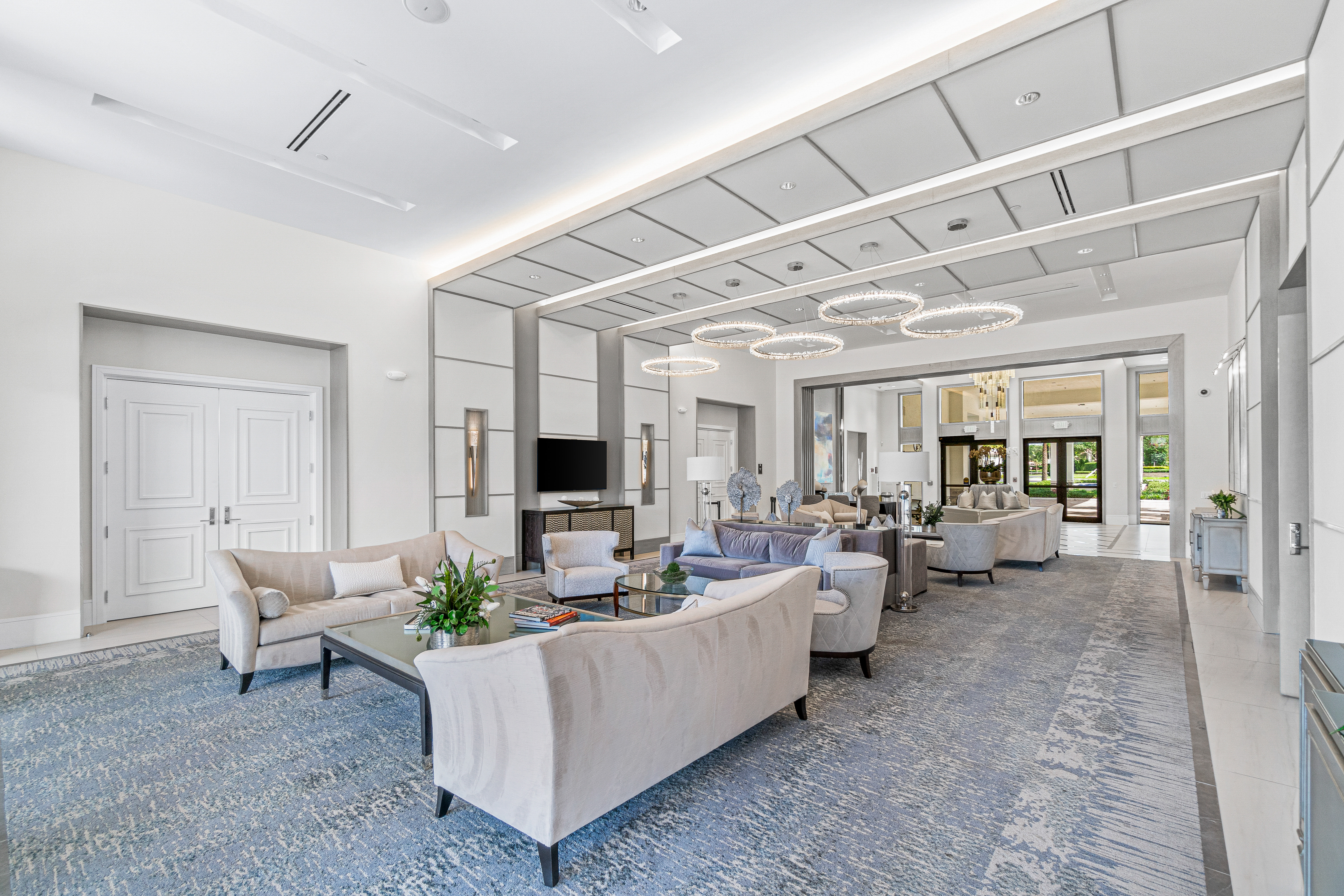 13172 Whistler Mountain Road Delray Beach, FL 33446 - Photo 35 of 38 a living room with furniture and a flat screen tv