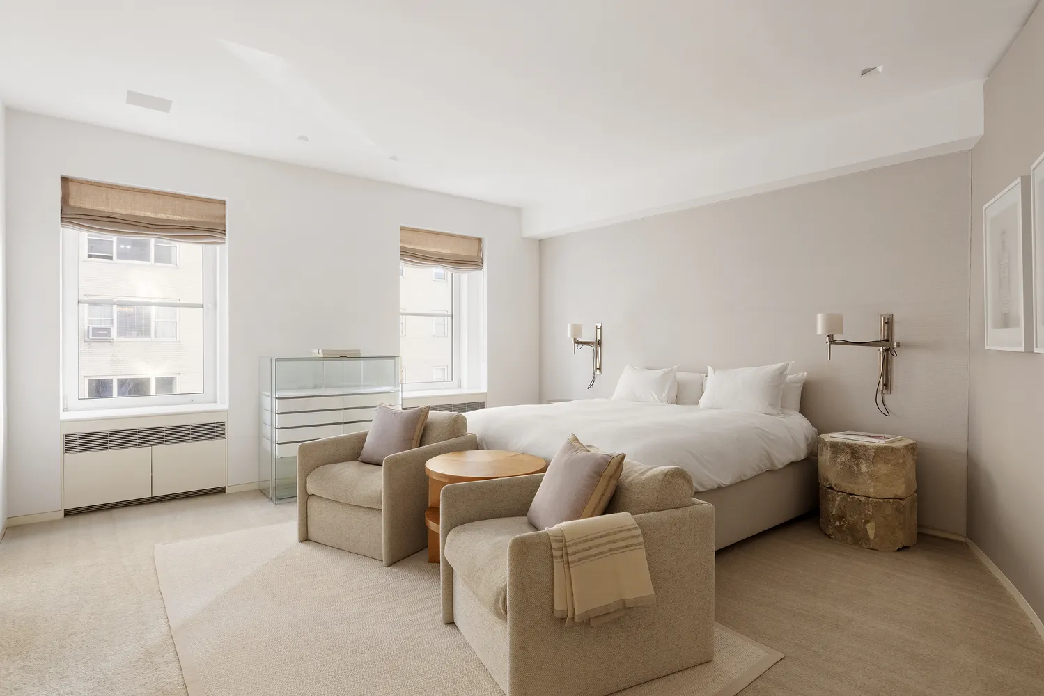 a bedroom with bed and a large window