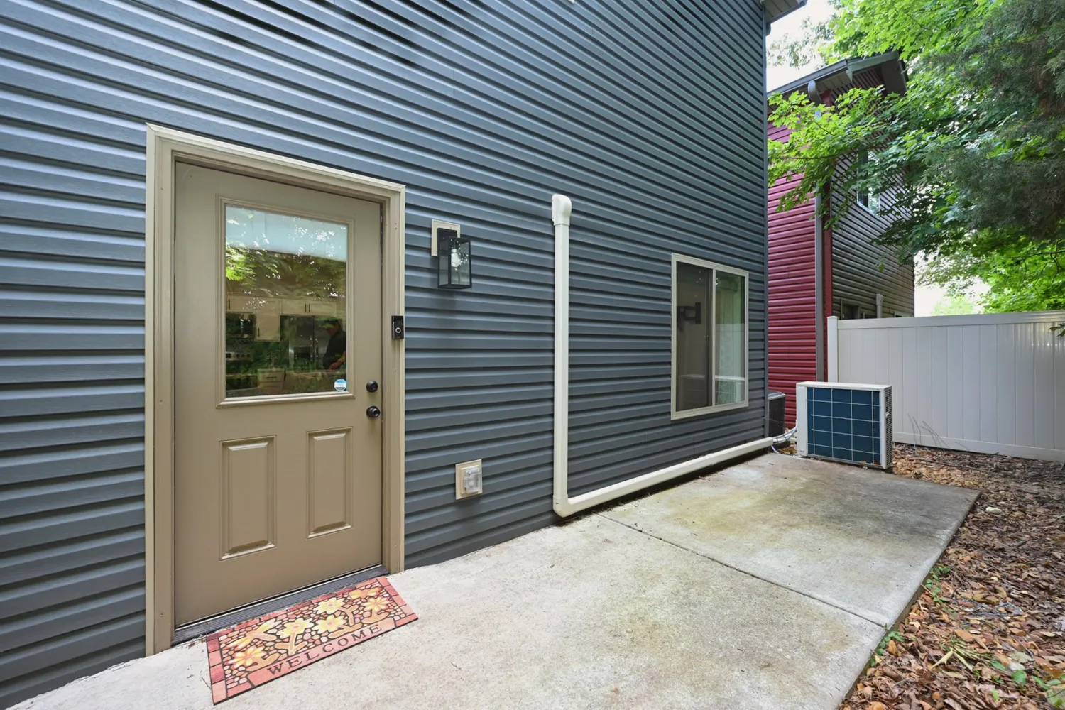 a view of an outdoor space with a door and windows