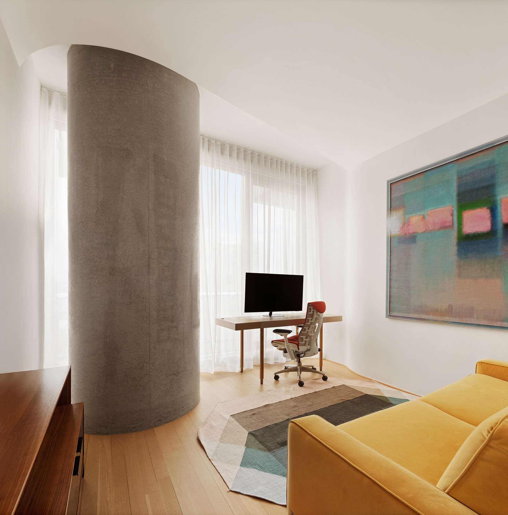 56 Leonard Street, Unit 21AWEST Manhattan, NY 10013 - Photo 7 of 11 a living room with furniture and a flat screen tv