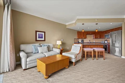 a bedroom with furniture and a rug