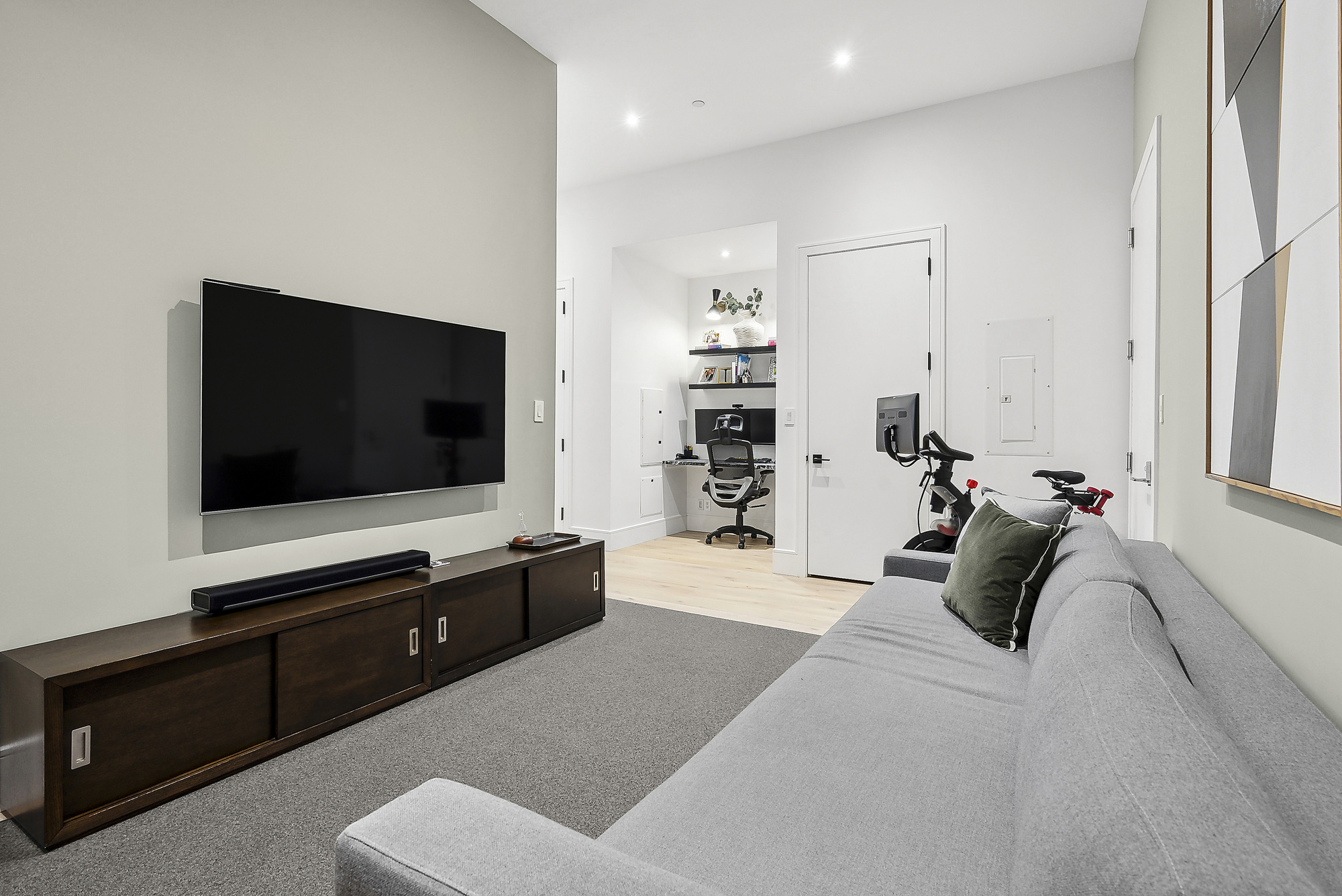 360 Furman Street, Unit 507/508 Brooklyn, NY 11201 - Photo 7 of 43 a living room with furniture and a flat screen tv