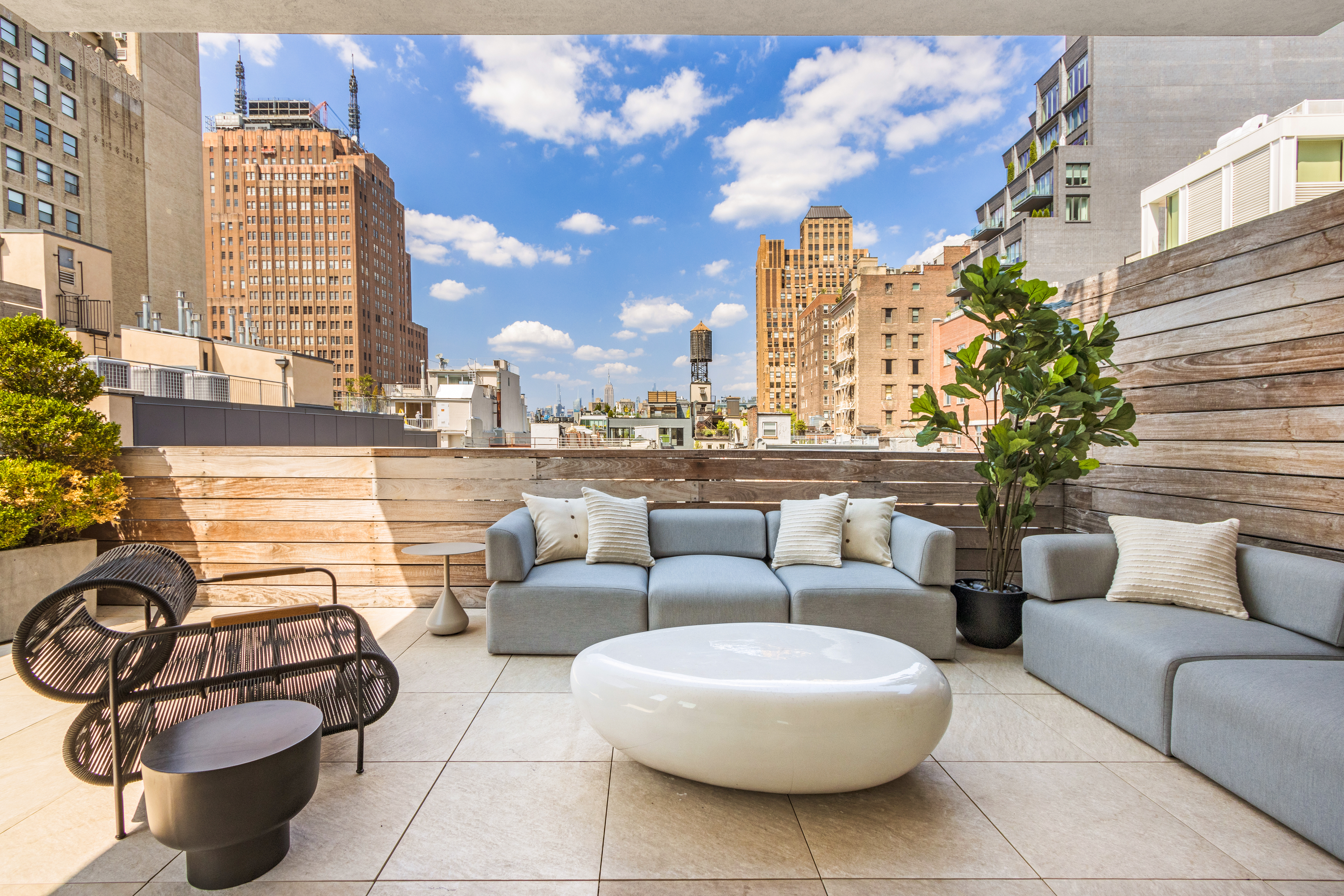85 Leonard Street, Unit PH Manhattan, NY 10013 - Photo 18 of 27 a view of a patio with couches and potted plants