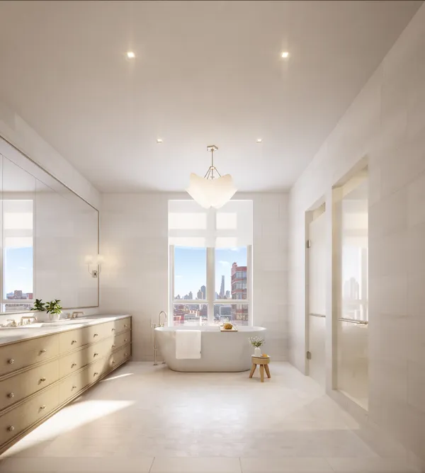 a bathroom with a tub sink and mirror
