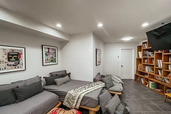 334 Plymouth Street Brooklyn, NY 11201 - Photo 28 of 32 a bedroom with furniture and a flat screen tv