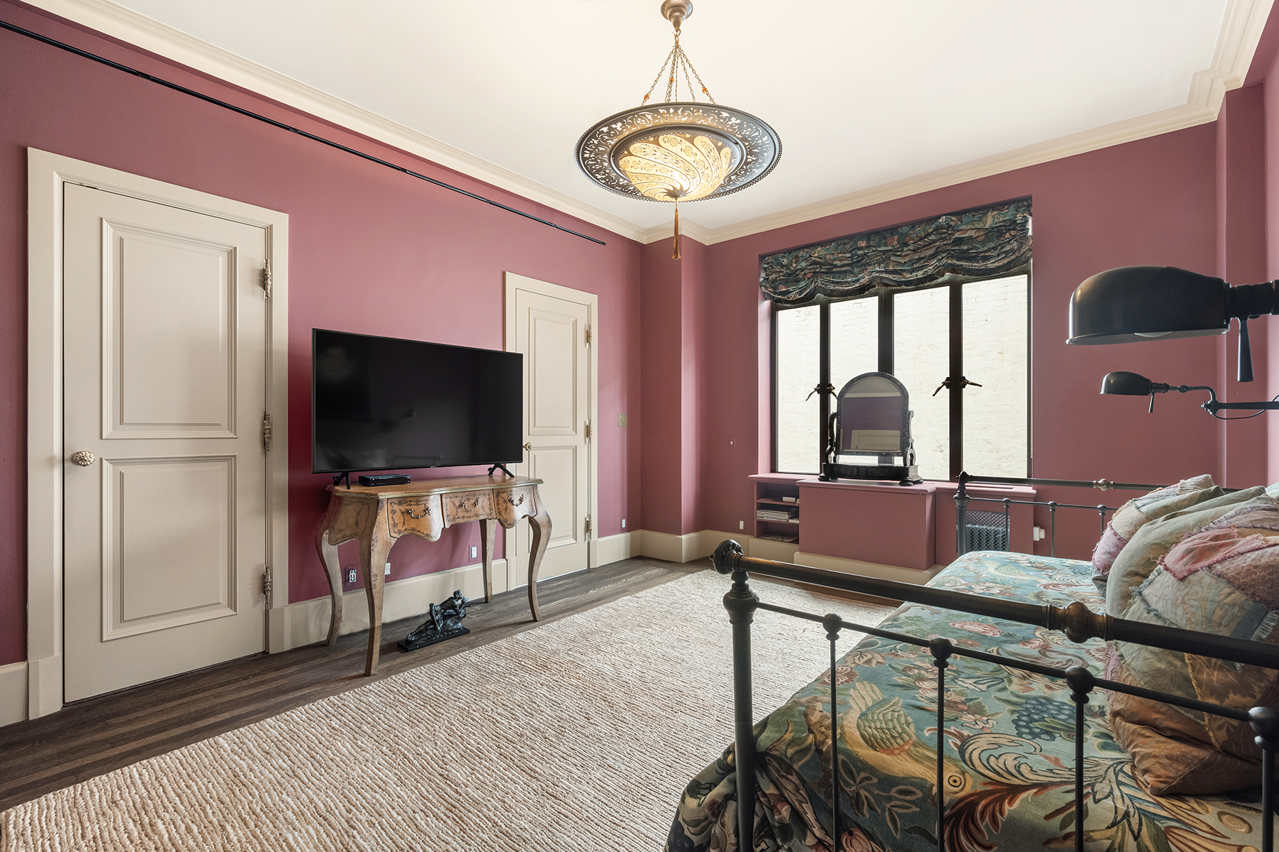 145-146 Central Park West, Unit 5G Manhattan, NY 10023 - Photo 16 of 18 a living room with furniture and a flat screen tv
