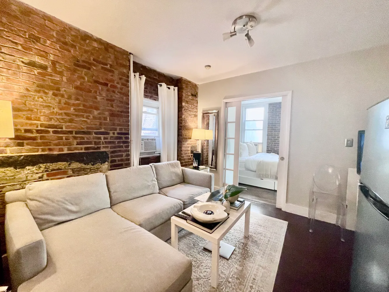 a living room with furniture and a fireplace