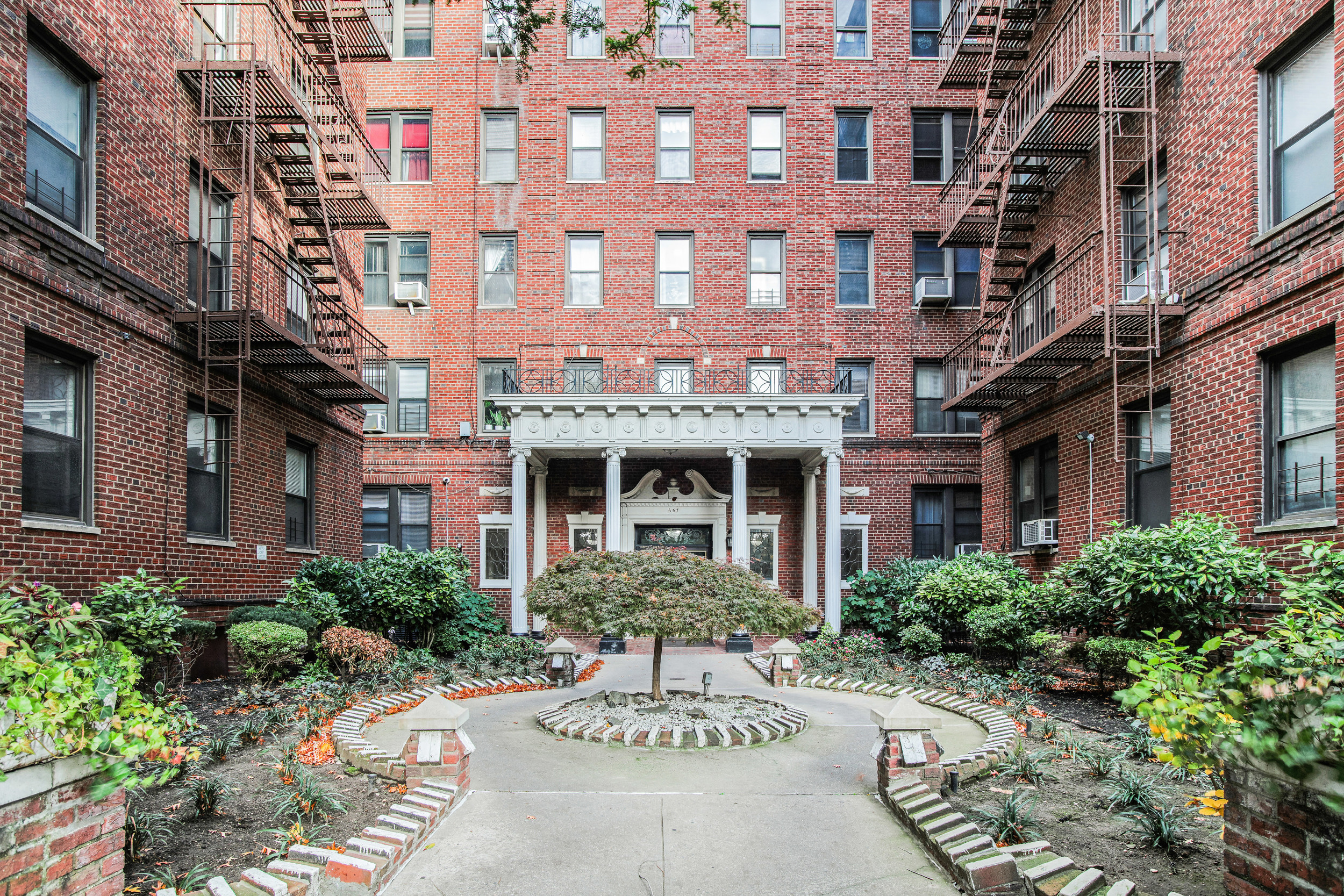 657 East 26th Street, Unit 3G Brooklyn, NY 11210 - Photo 13 of 14 a view of a building and a garden