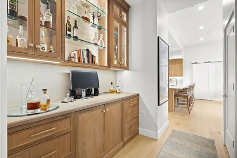 a kitchen with a cabinets and chairs in it