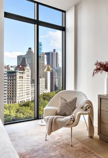 a living room filled with furniture and a window