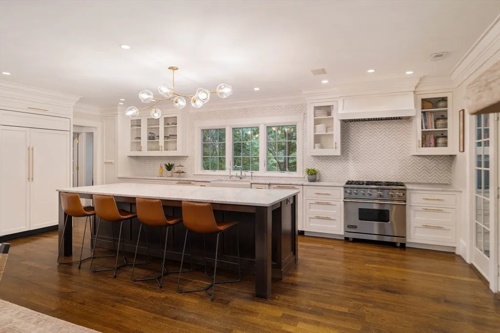 a kitchen with stainless steel appliances granite countertop a sink and cabinets