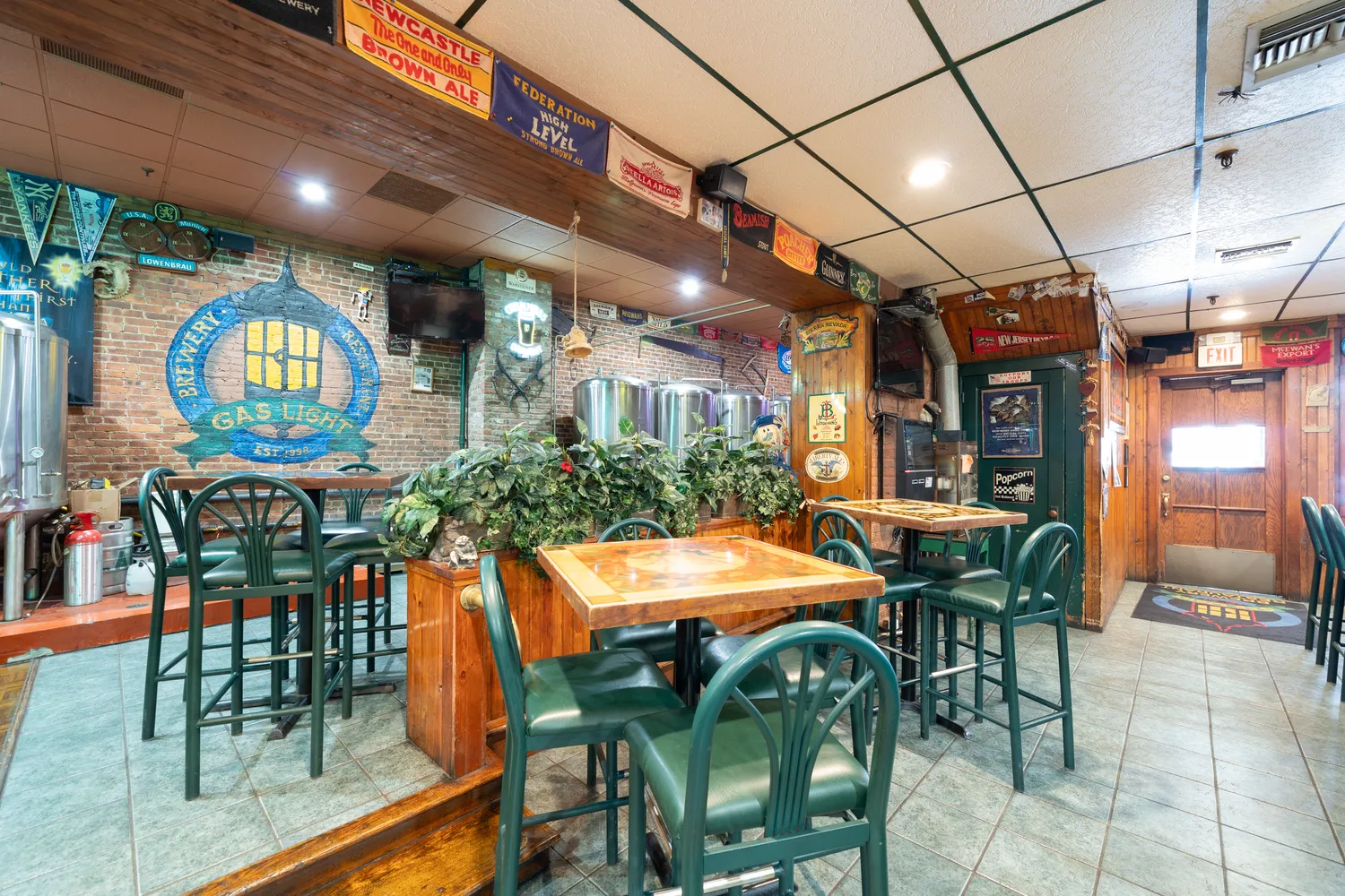 a dining area with furniture and a projector