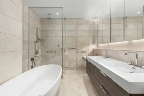 a bathroom with a bathtub and a sink