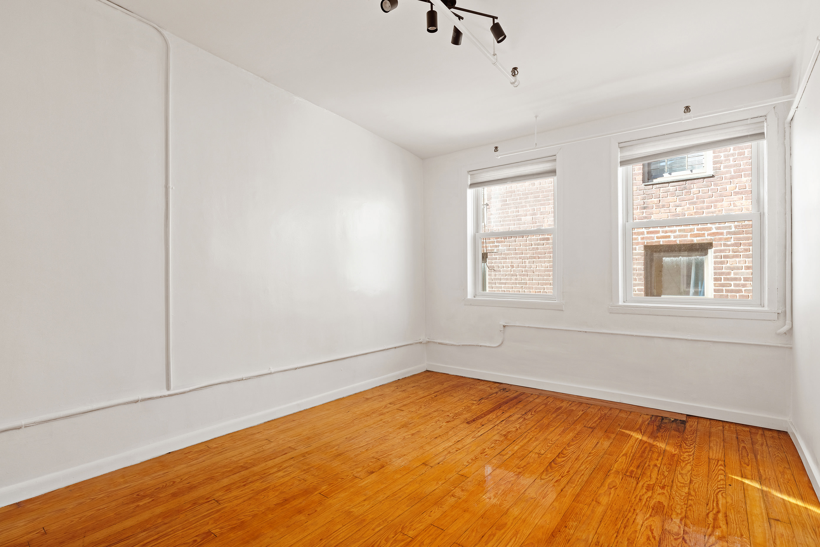 71 8th Avenue, Unit 4R Manhattan, NY 10014 - Photo 4 of 5 a view of empty room with window