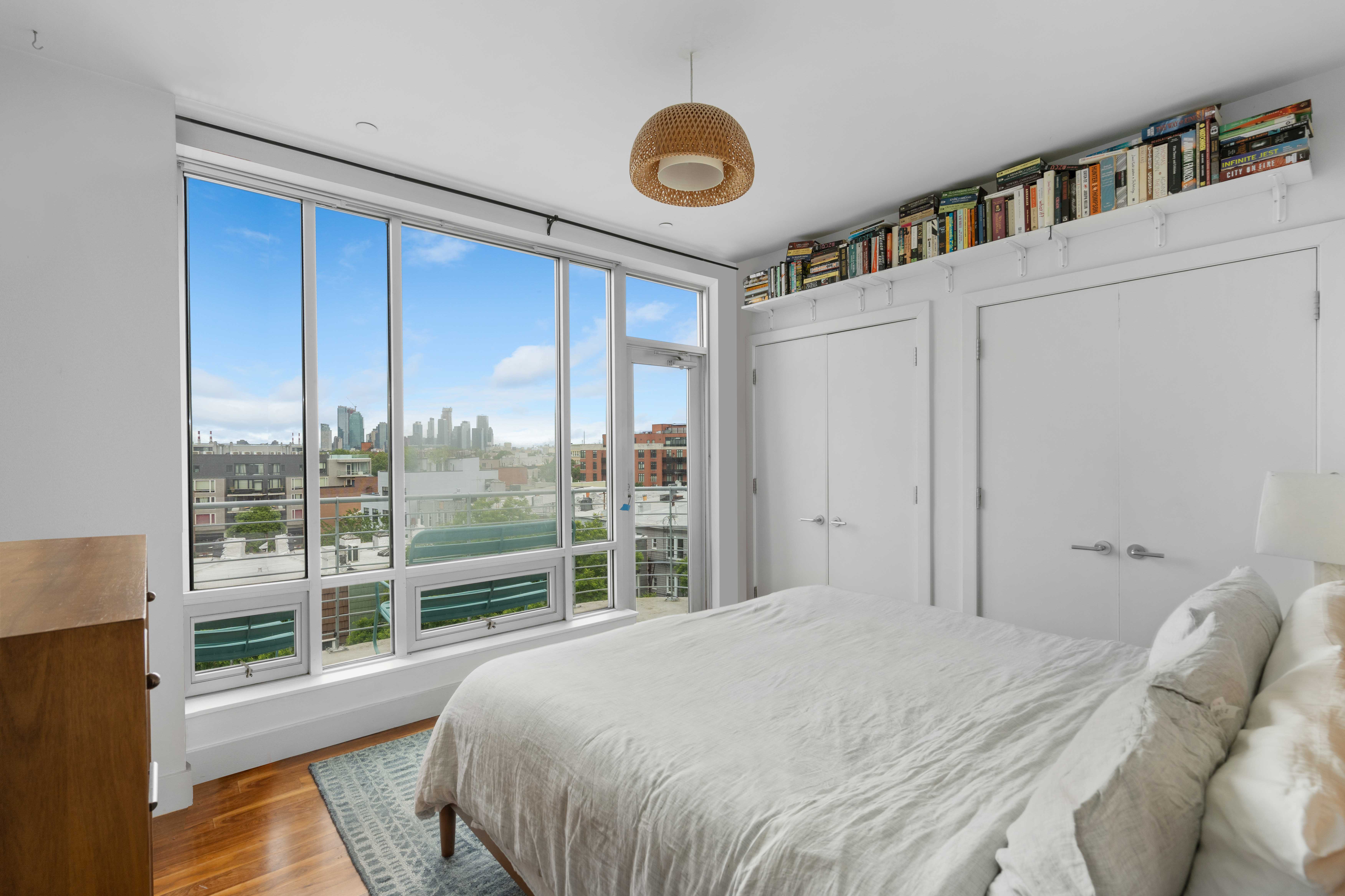 36 Eckford Street, Unit 6B Brooklyn, NY 11222 - Photo 4 of 8 a bedroom with a large bed and a large window