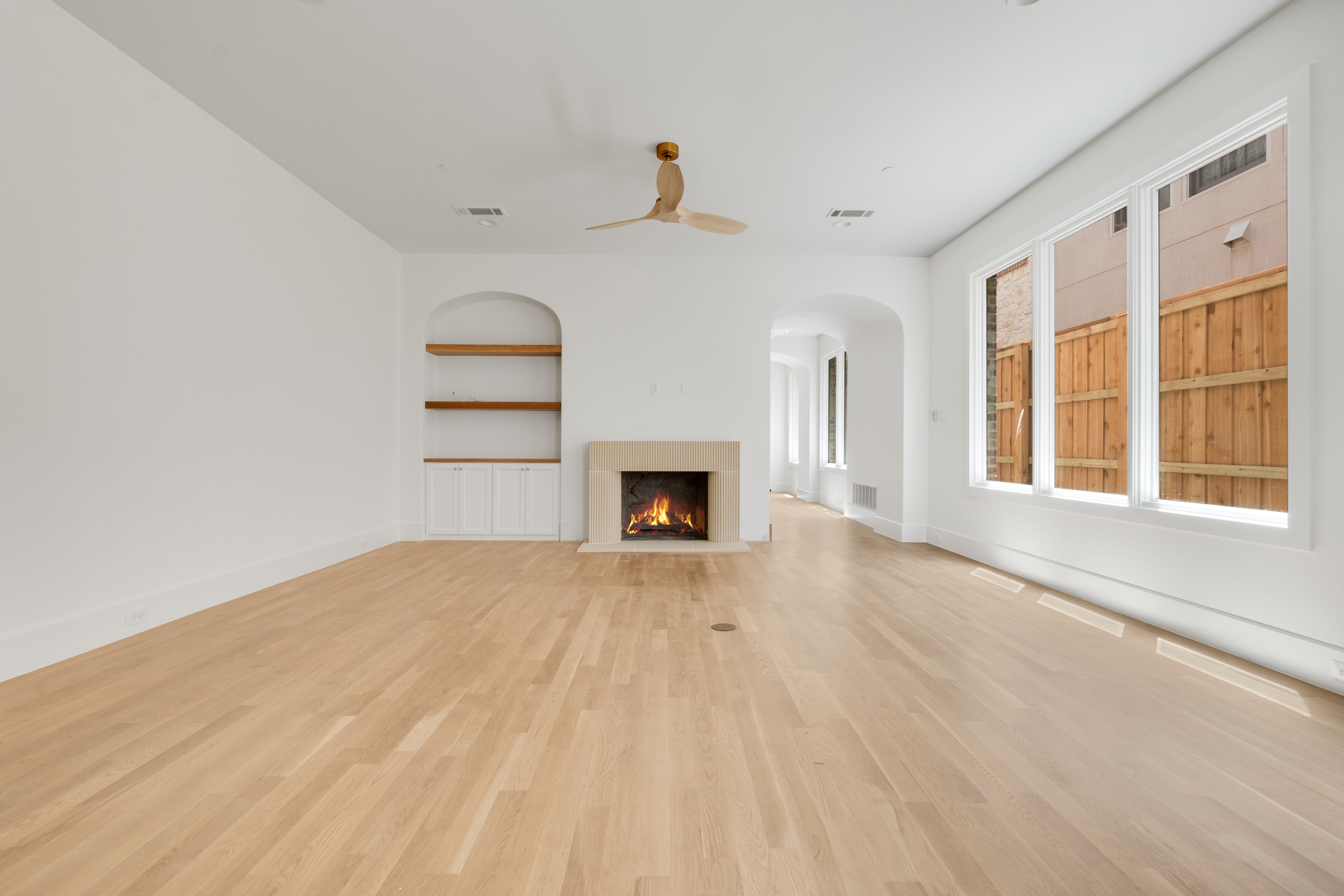 4410 Glenwick Lane Dallas, TX 75205 - Photo 17 of 28 a view of empty room with wooden floor and fireplace