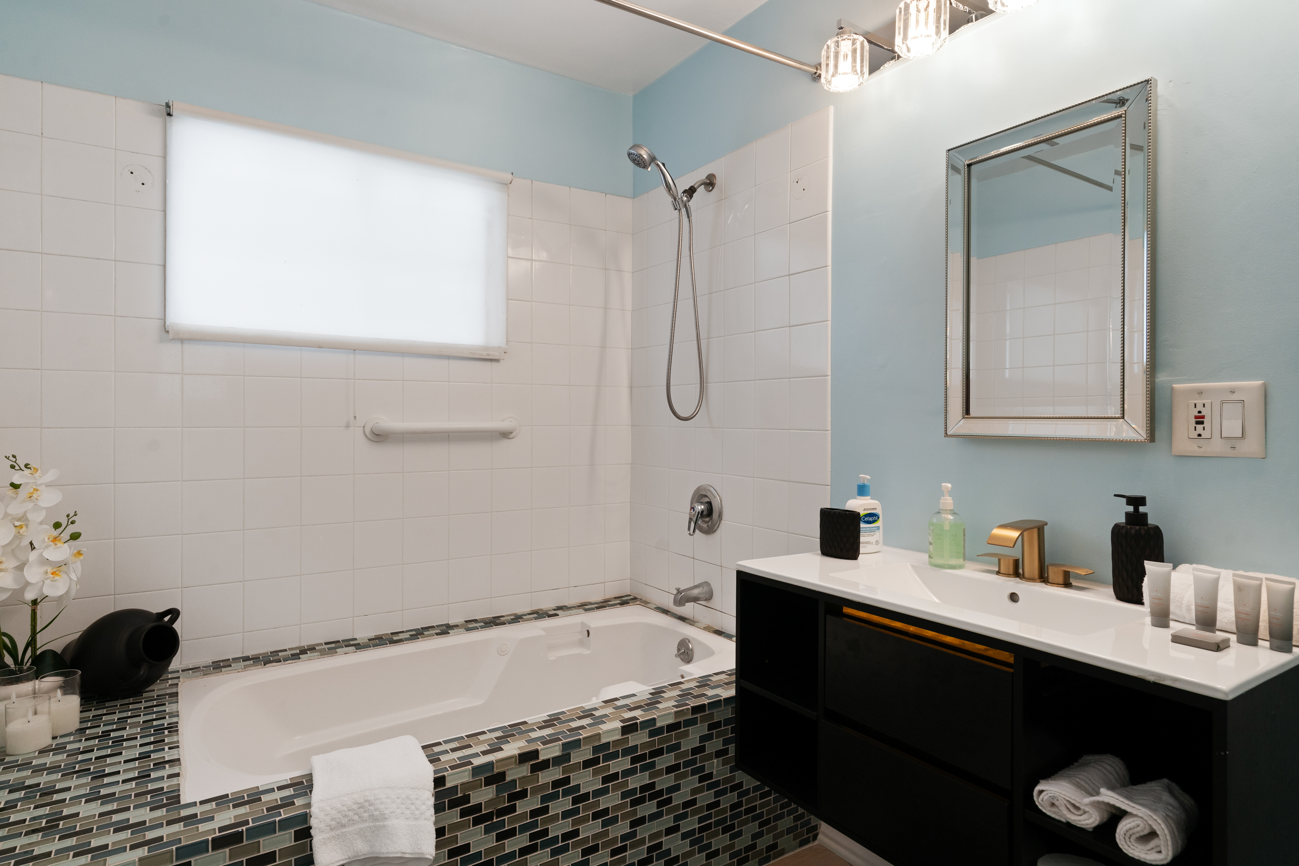 8832 Horner Street Los Angeles, CA 90035 - Photo 13 of 24 a bathroom with a sink and a mirror