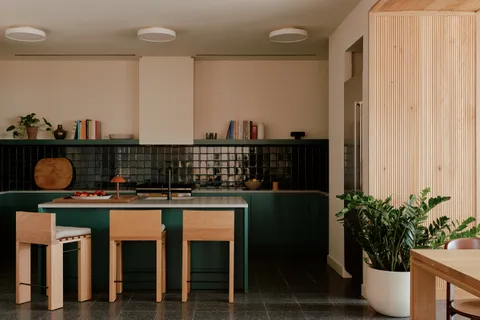 a kitchen with a table and chairs in it